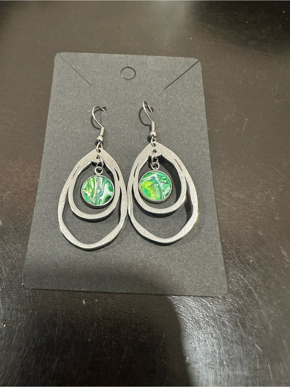 Silver Dangle Earrings with Green Swirl Accents